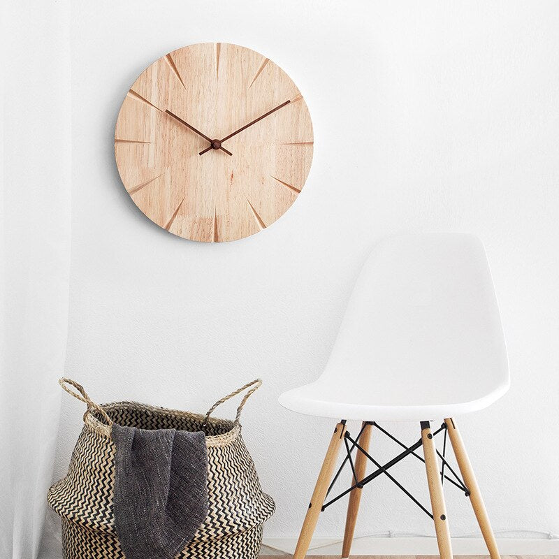 Minimalist wooden wall clock with a smooth finish and elegant design, perfect for home or office decor.